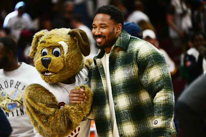 Apr 18, 2023; Cleveland, Ohio, USA; Cleveland Browns player Myles Garrett poses for a photo with Cleveland Cavaliers mascot Moondog after the Cavaliers beat the New York Knicks in game two of the 2023 NBA playoffs at Rocket Mortgage FieldHouse.